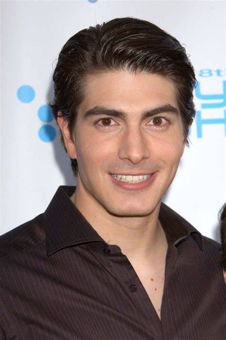 Brandon Routh stands in full Superman costume on Lex Luthor's Kryptonite island in a still from Superman Returns