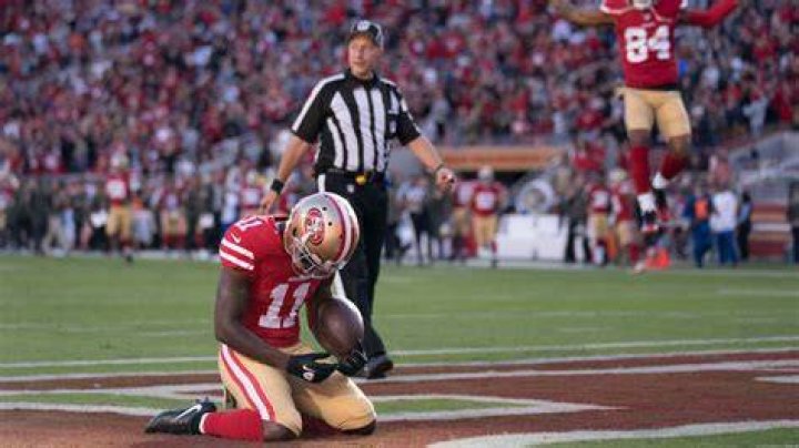 Marquise Goodwin parents: Tamina Goodwin 1 goodwin praying td usatsi