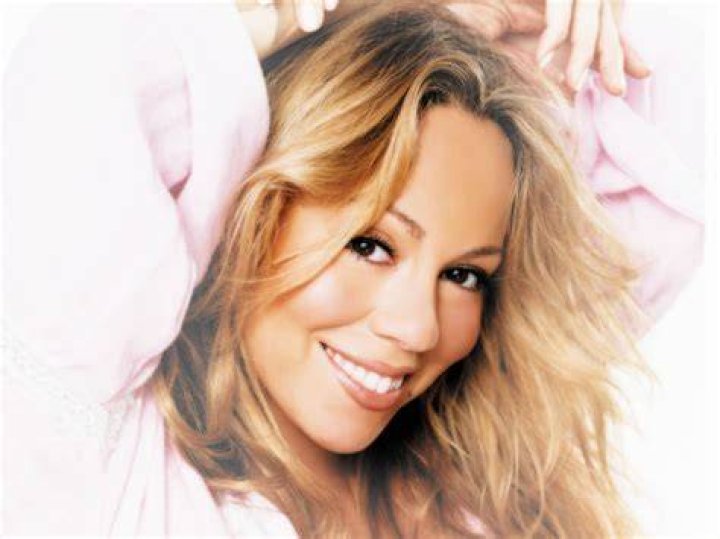 Mariah Carey smiling in the “All I Want For Christmas Is You” music video